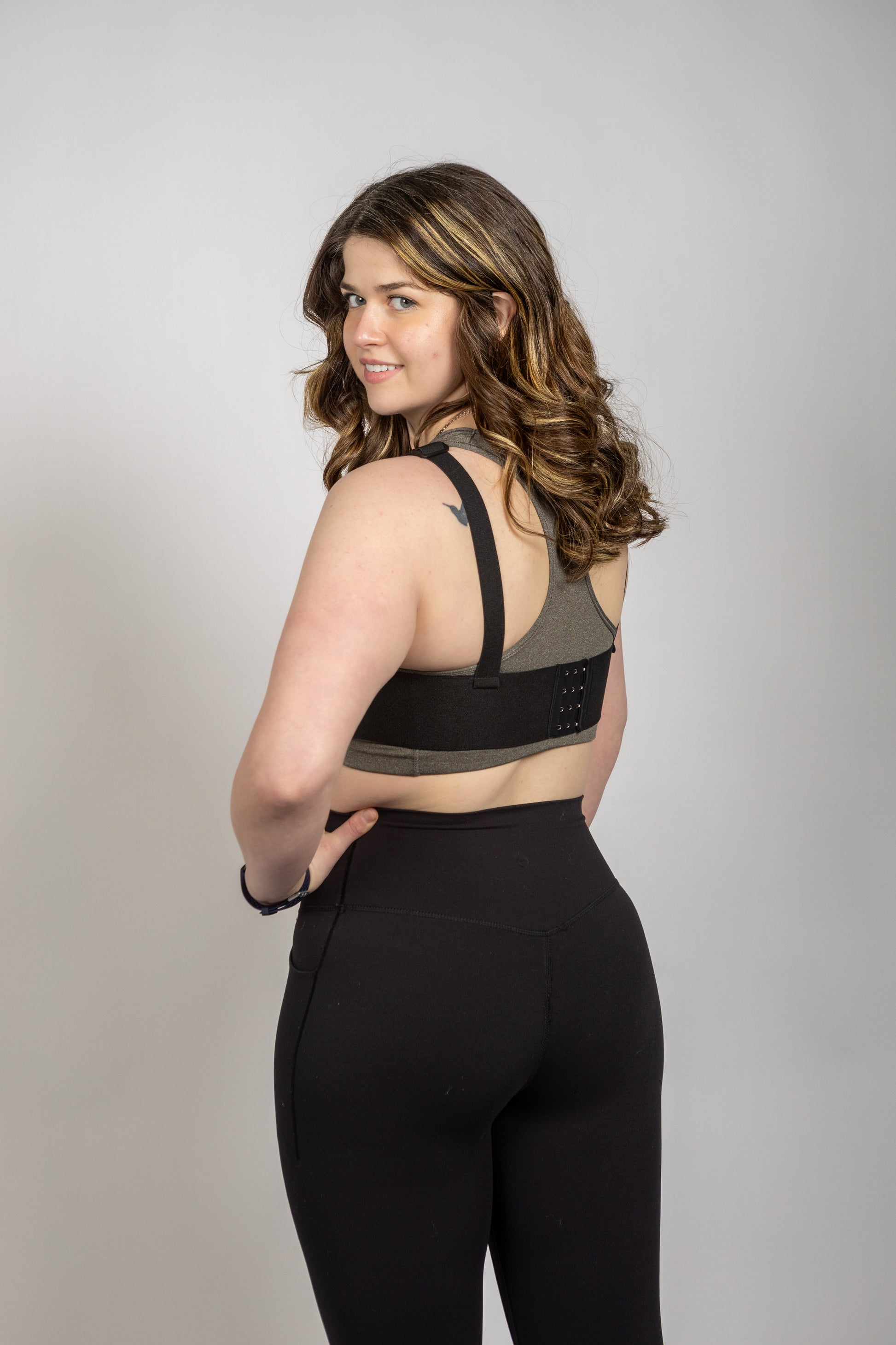 Back view of the WRAX Max bounce control harness highlighting the five-point adjustable design for a customized fit and maximum comfort during high-impact exercise.