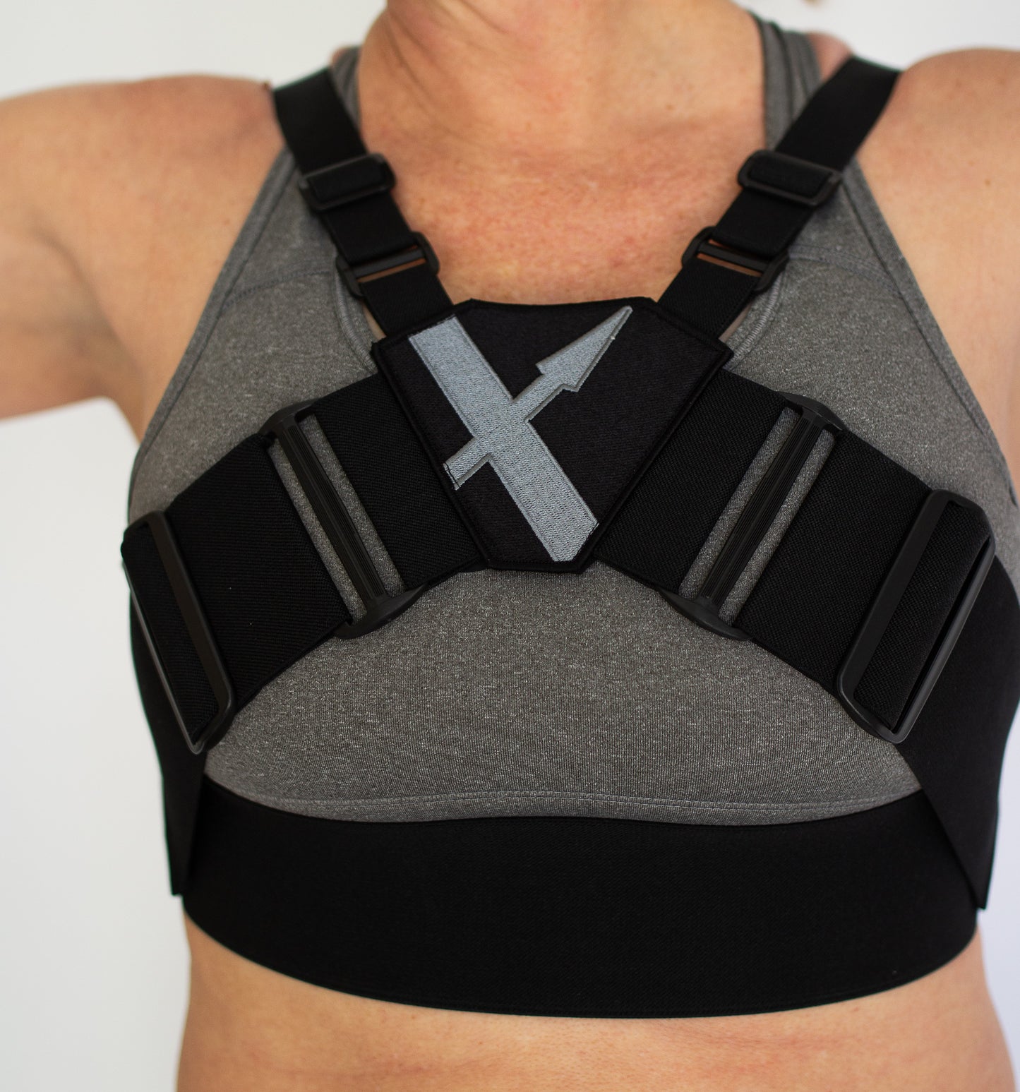 Close-up of the WRAX Max bounce control harness highlighting the five-point adjustable design that provides a customized fit for women with larger cup sizes during running, equestrian sports, HIIT, and high-impact exercise.