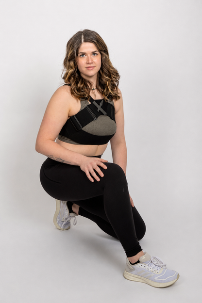 Front view of the WRAX Max bounce control harness showing patented top-down support for women seeking maximum bounce control during exercise.