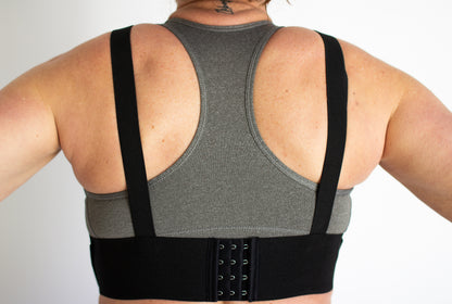 Back view of the WRAX Max bounce control harness featuring a fully adjustable fit system for women seeking better support during running, horseback riding, fitness training, and other high-impact activities.