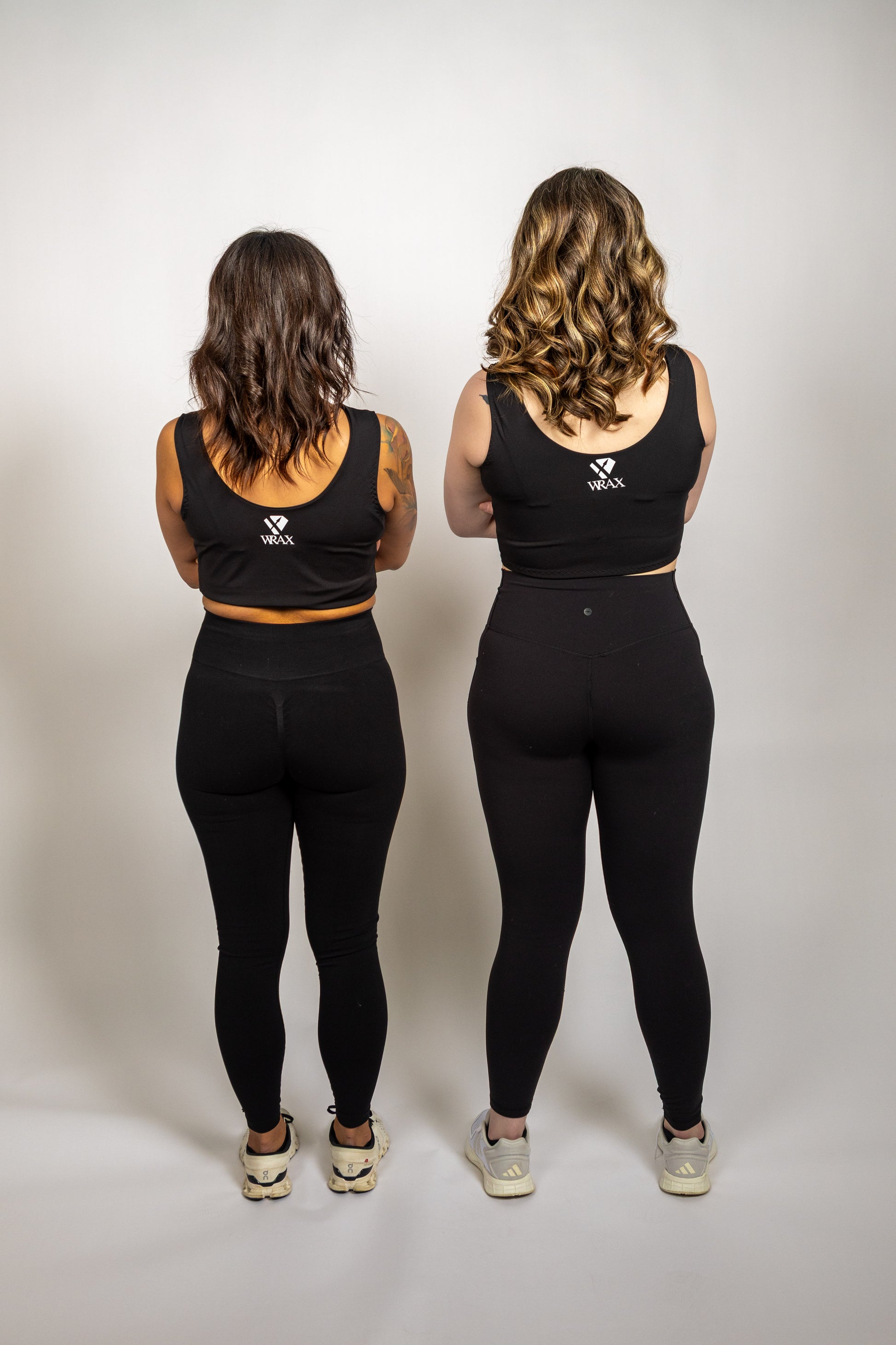 Athletes wearing WRAX Apex sports bras featuring patented technology to control breast movement during high-impact exercise and combat sports.